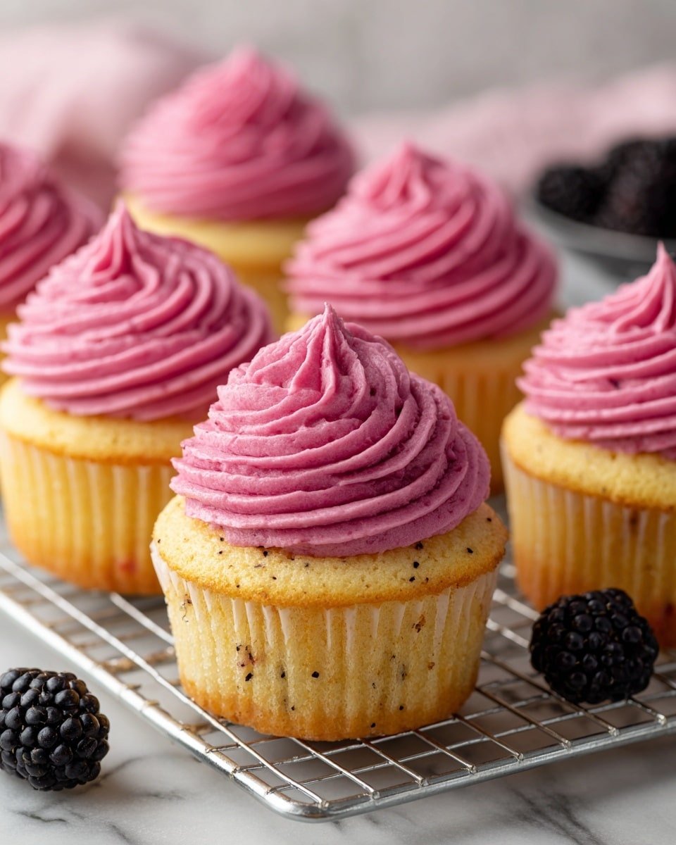 Lemon Poppy Seed Cupcakes with Blackberry Frosting Recipe - Recipe Image — Lemon Poppy Seed Cupcakes with Blackberry Frosting, lemon poppy seed cupcake recipes, blackberry frosting ideas, spring cupcakes with lemon and berries, citrus cupcake with fruit frosting